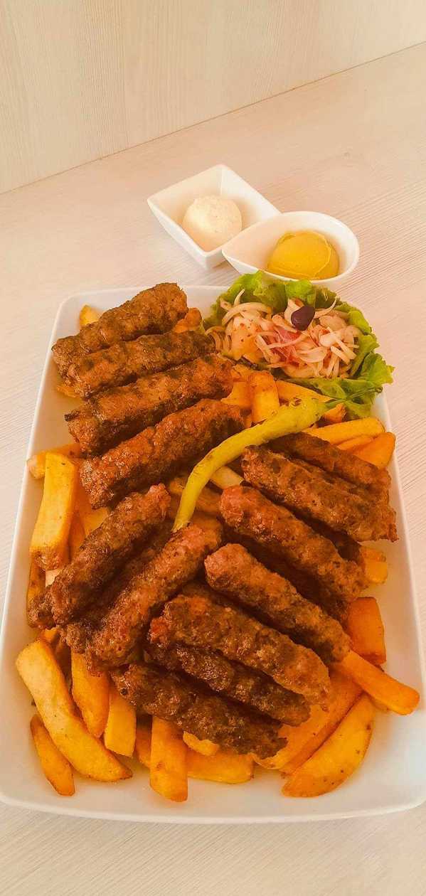 Grilled minced meat rolls platter