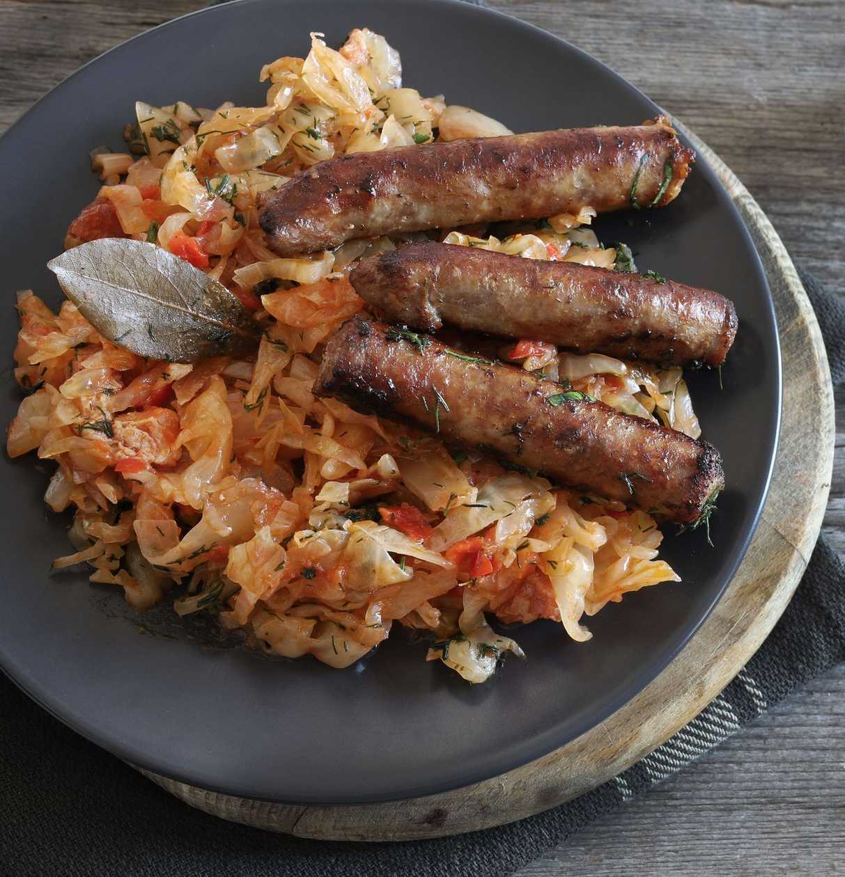 Braised cabbage with homemade sausages or cabanos sausages