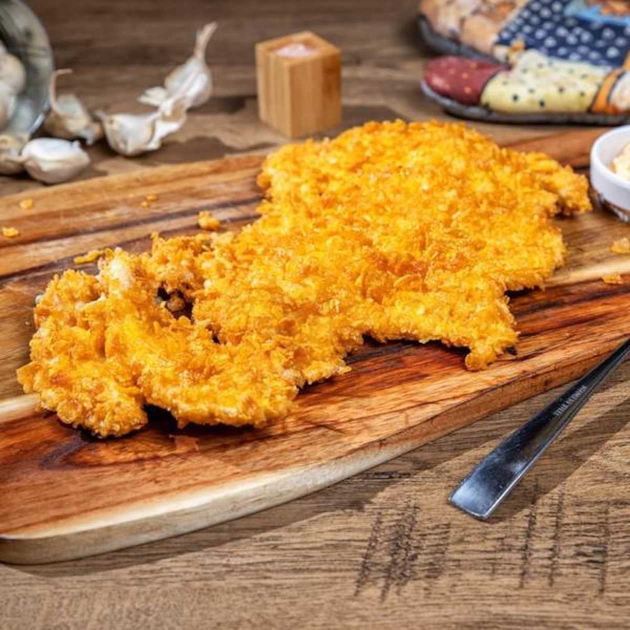Giant chicken schnitzel in cornflakes crust
