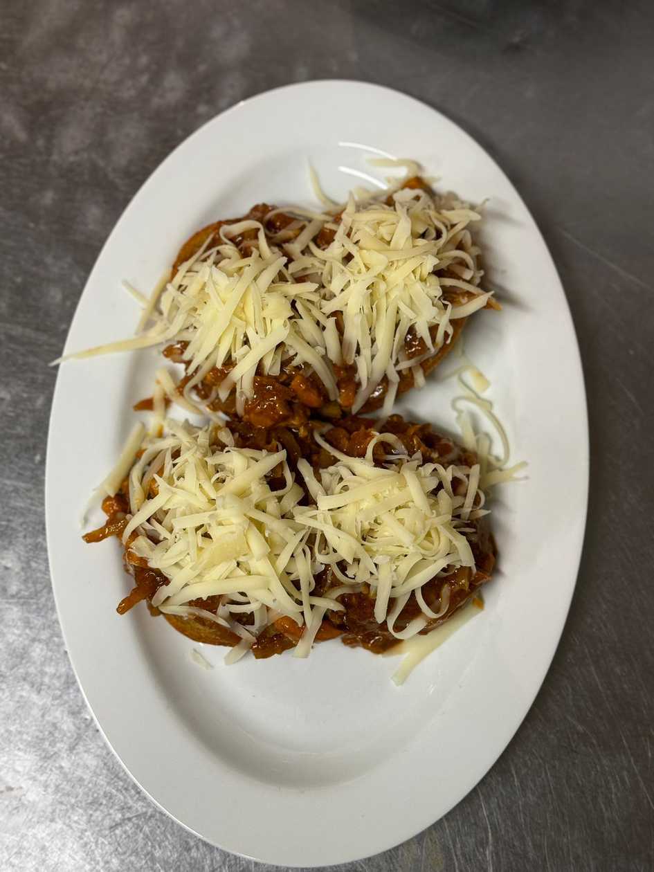 Devil's meat mixture on toast topped with cheese
