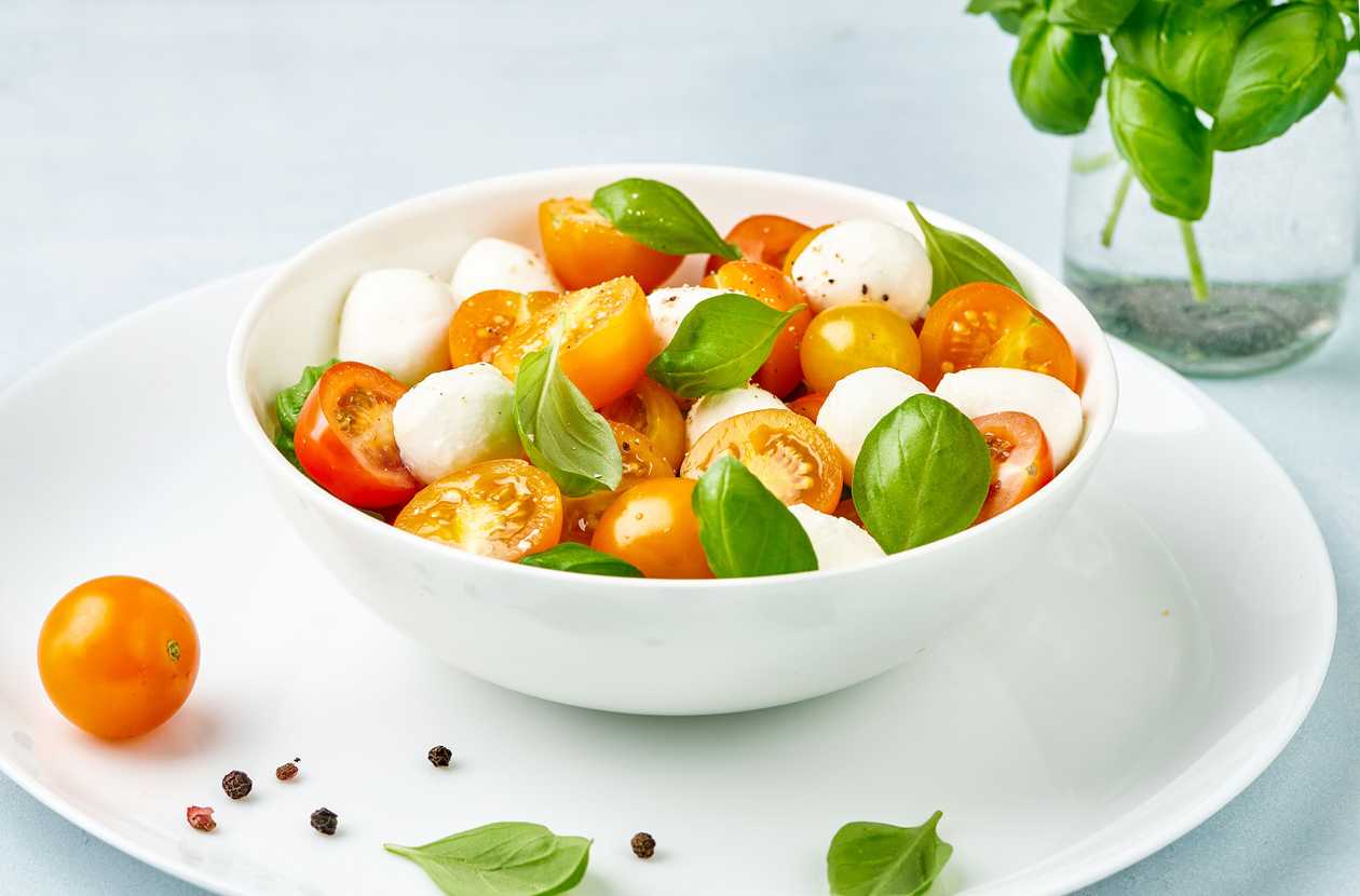 Caprese with cherry tomatoes, fresh basil