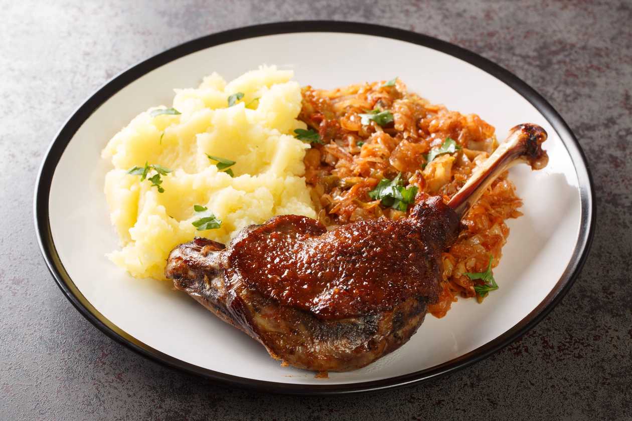 Roasted duck, steamed cabbage, potato pancake, homemade dumpling