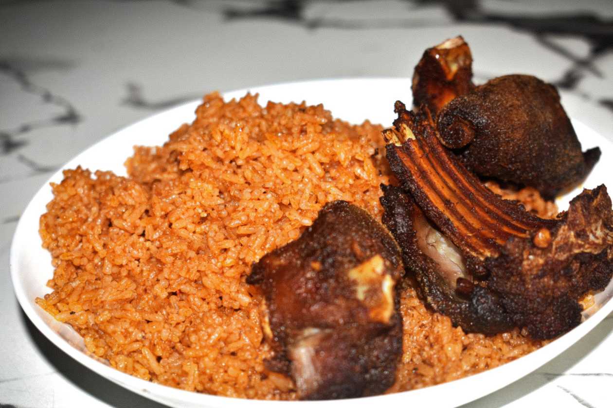 Jollof Rice With Spicy Goat Meat And Plantain