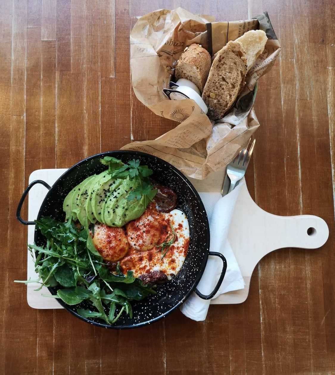 2 Spanish Style Eggs with Smoked Ground Peppers, Dried Tomatoes and Rosemary & avocado