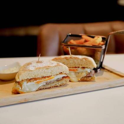 Steak Sandwich with Buttered Cheese, Caramelized Onion, and Egg