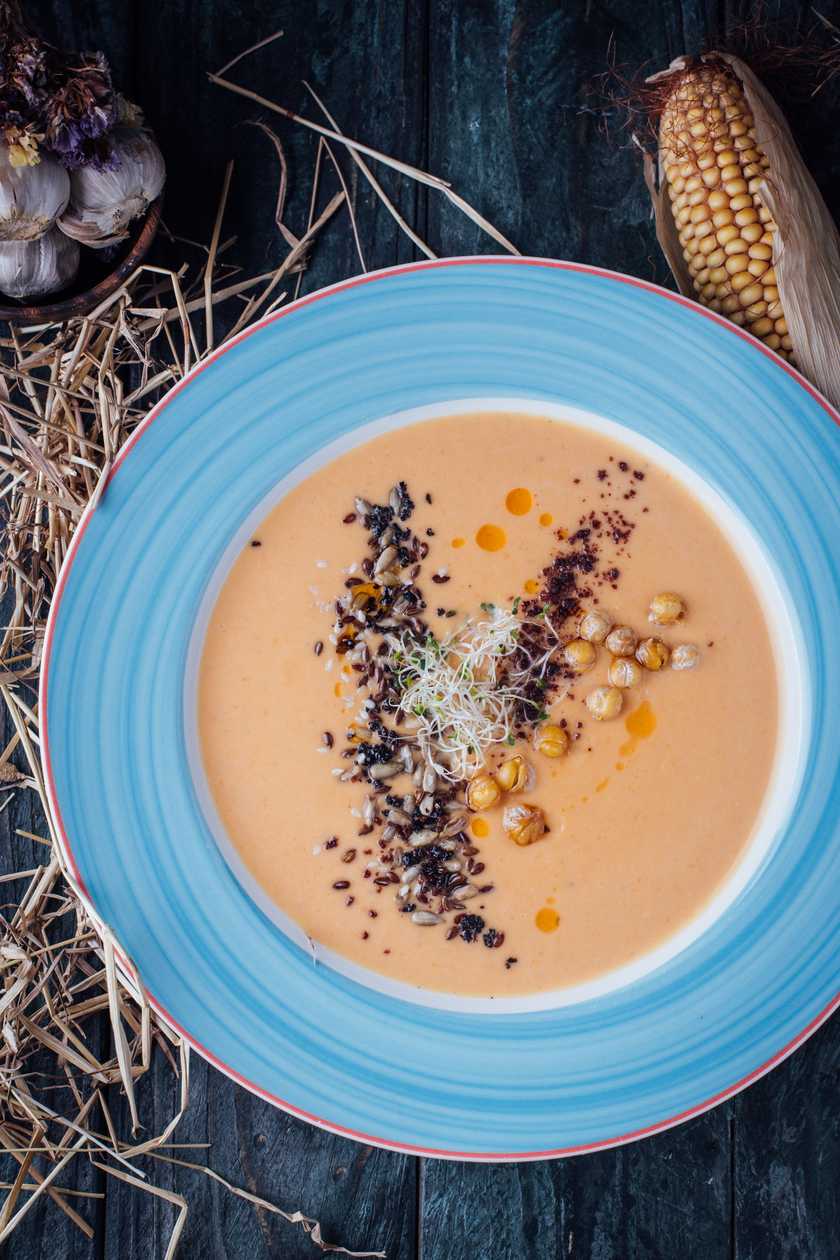 Creamy boletus mushroom soup with brandy and truffle sals