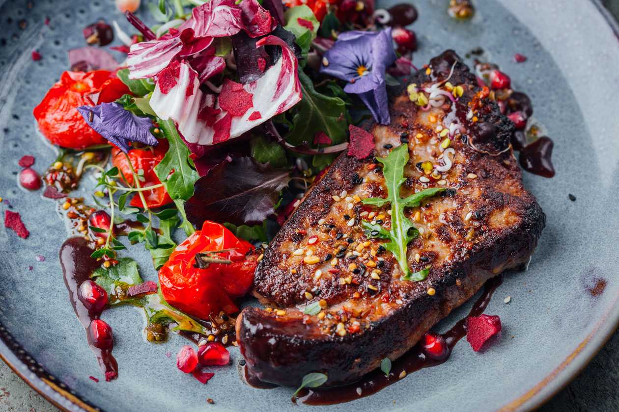 Veal liver steak with mashed potatoes and wine sauce