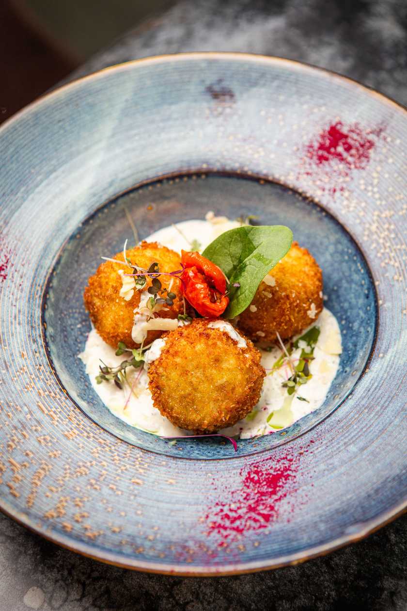 Arancini trio with black truffle sauce