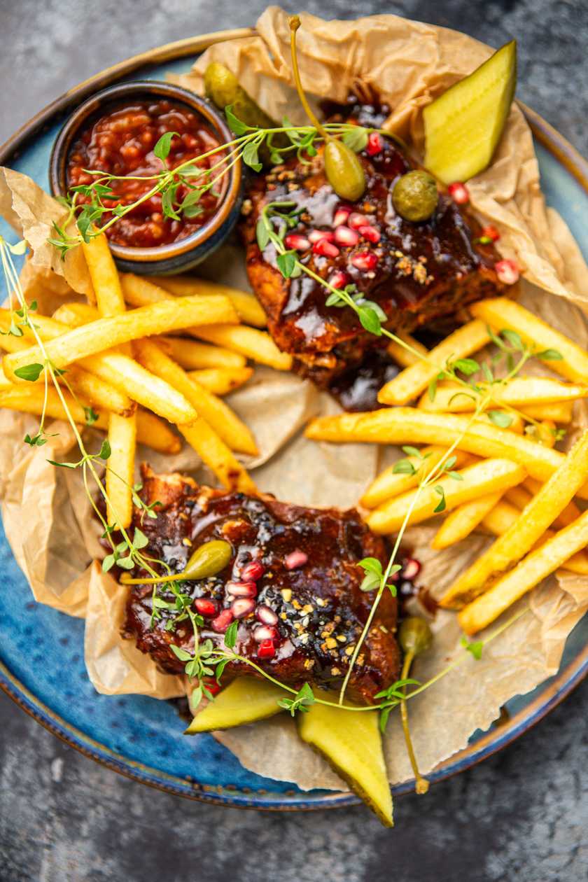 Slow Cooked Pork Ribs with fries and tomato-adjika spicy sauce