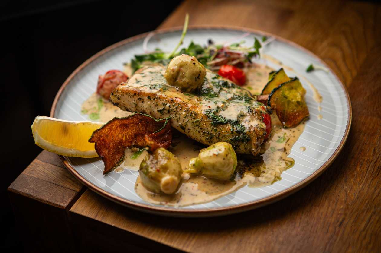 Grilled salmon steak with broccoli and cauliflower cream