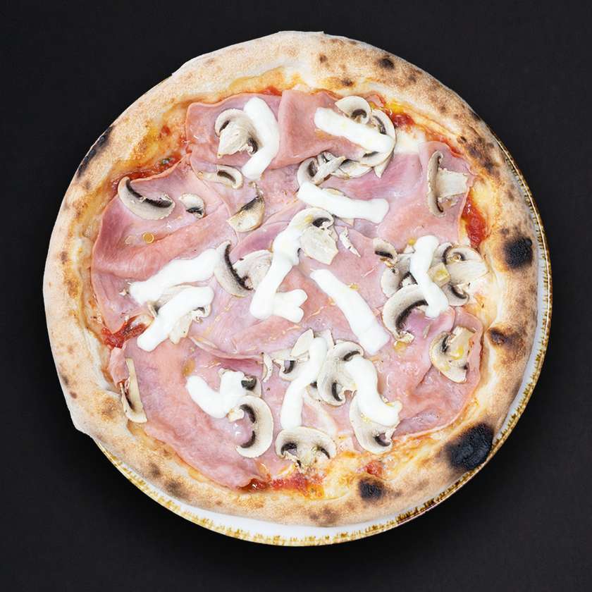 Pizza prosciutto funghi