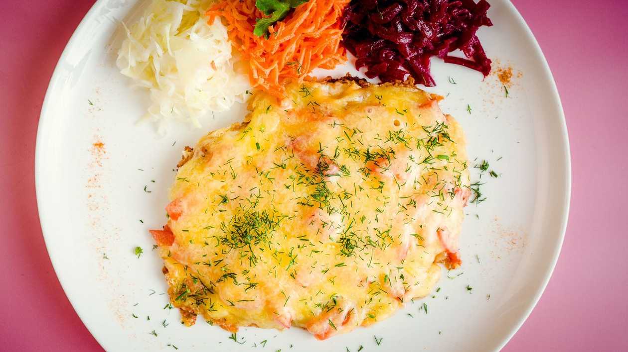 Chicken fillet with cheese and tomato cap