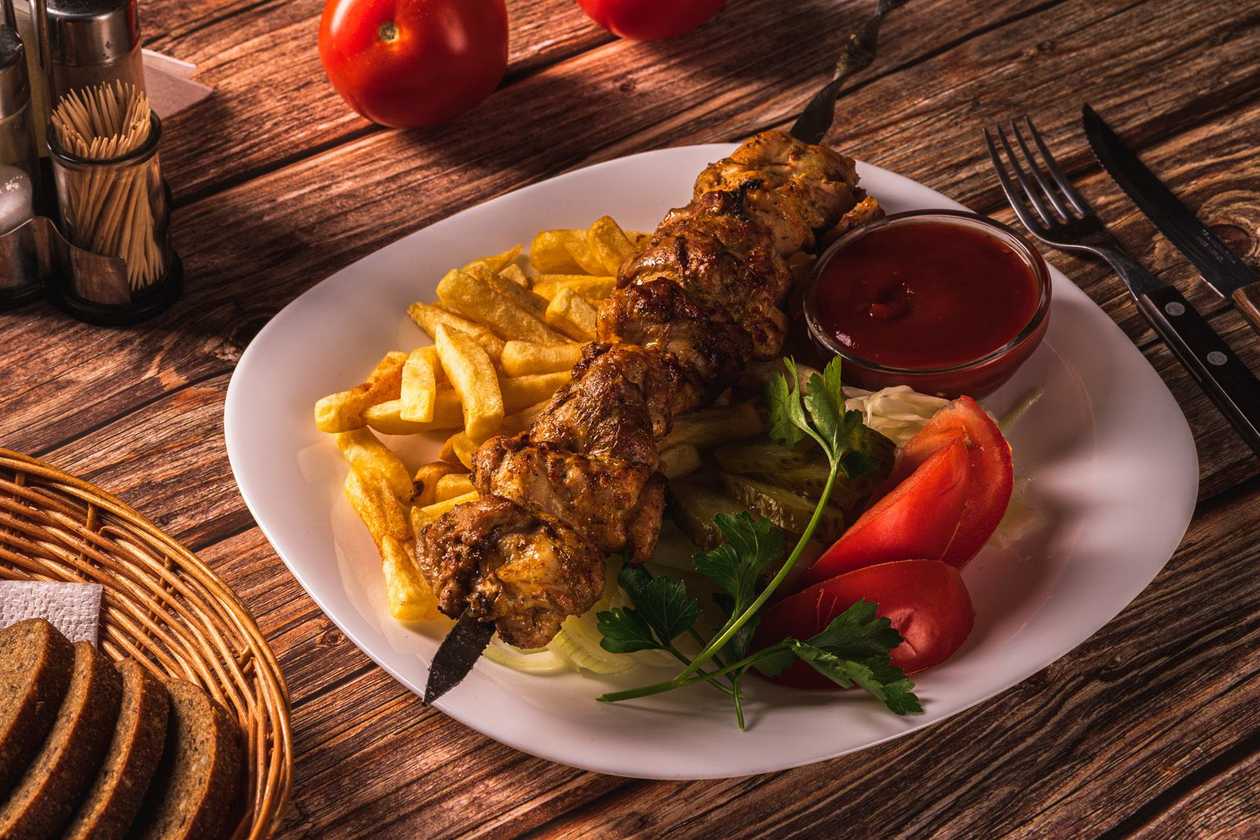 Chicken shashlik with french fries and ketchup