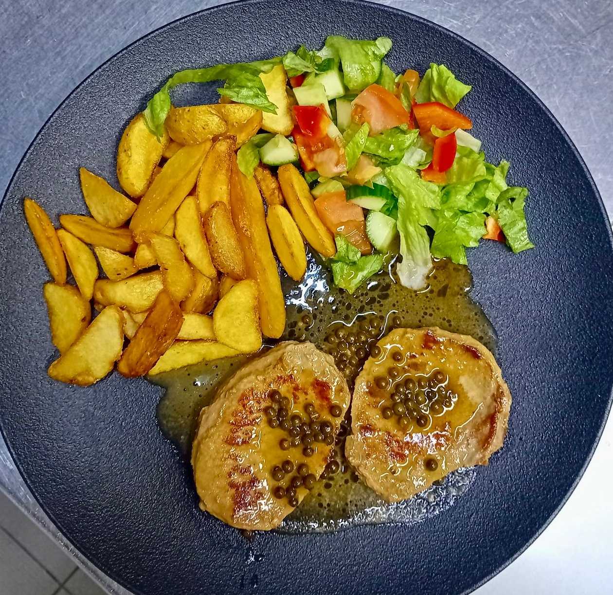Pork steak on green pepper