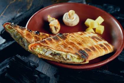 Lavash khorovadz with cheese, chicken, and mushrooms