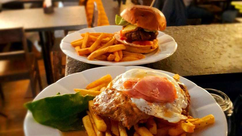 Grilled Pork Collar Steak with Fried Egg, Garnished with Slice