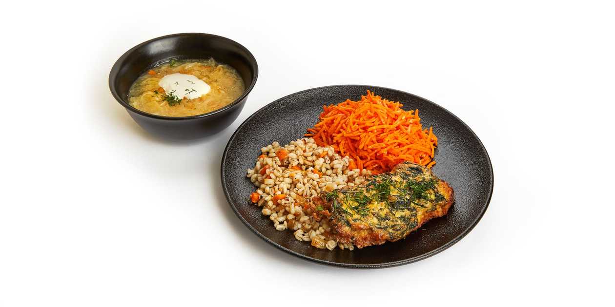 Sauerkraut soup and fried chicken fillet with spinach, pearl barley and carrot salad