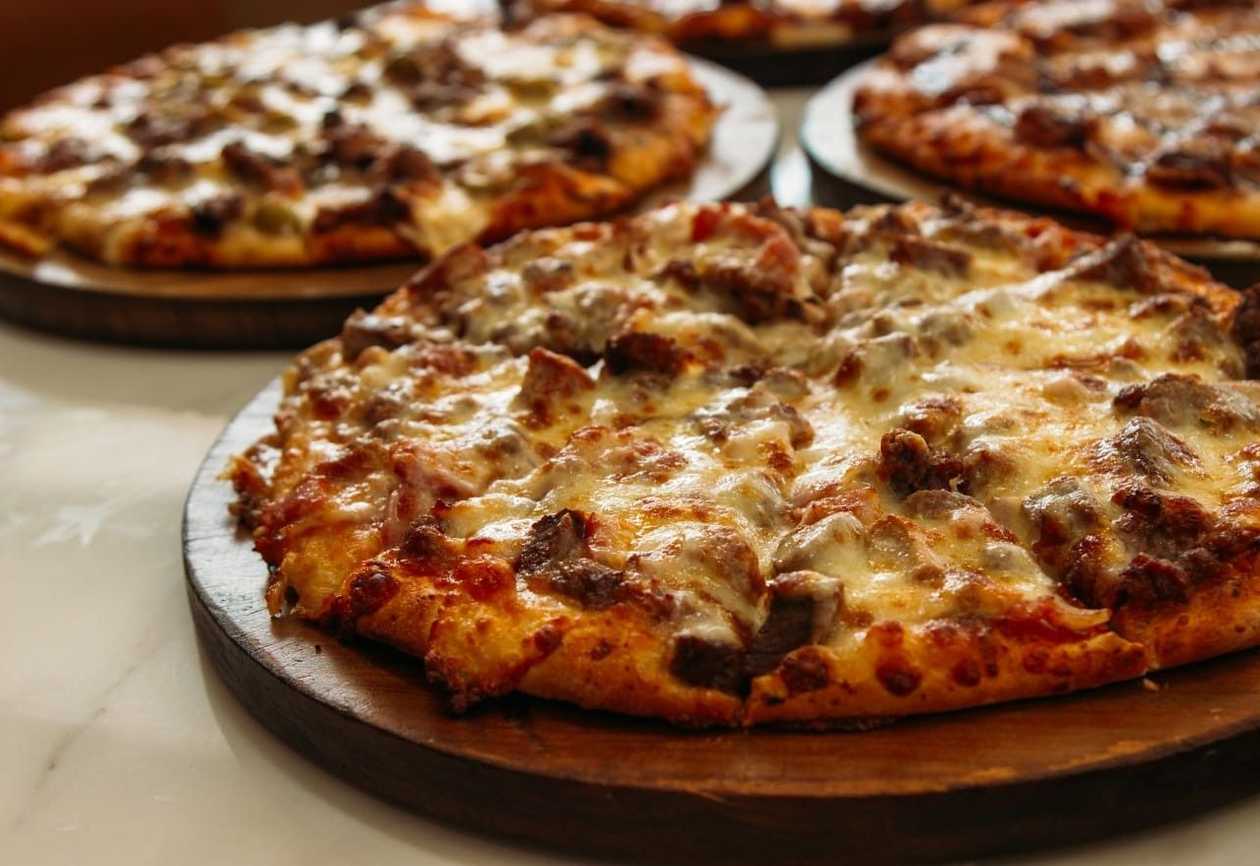 One Lage Pizza, One Large Chips, Eight Chicken Pieces, and Two Litres of  Soda