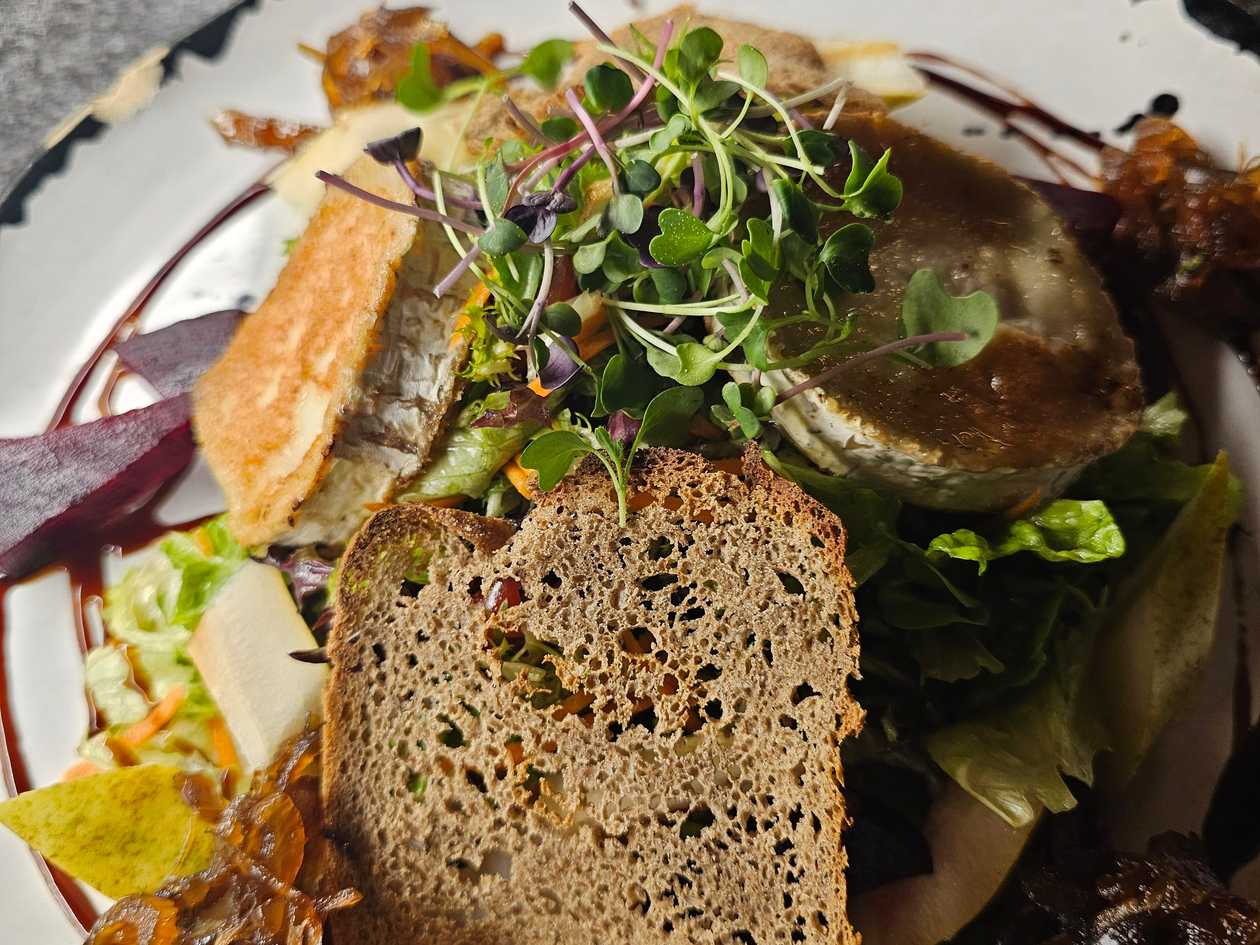 Grilled goat cheese on lettuce leaves