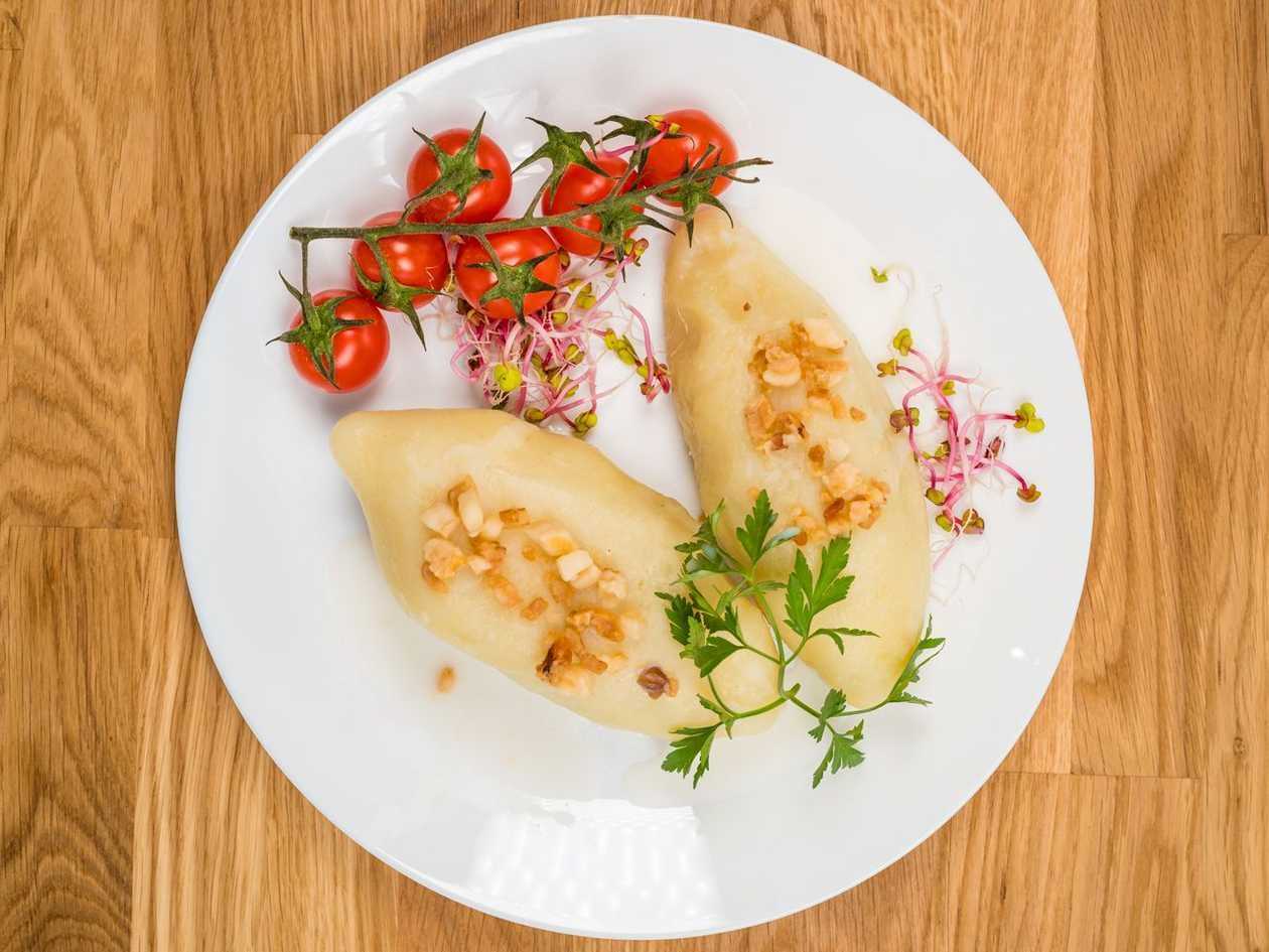 Grape-meat dumplings with lard and parsley