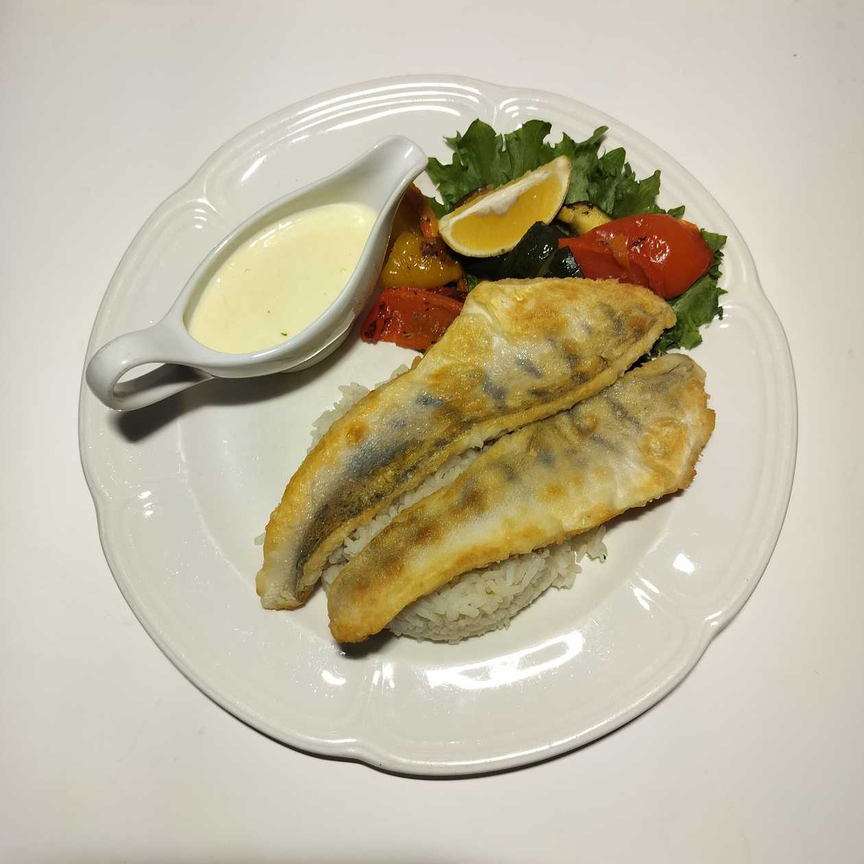 Grilled zander with local rice and wok vegetables