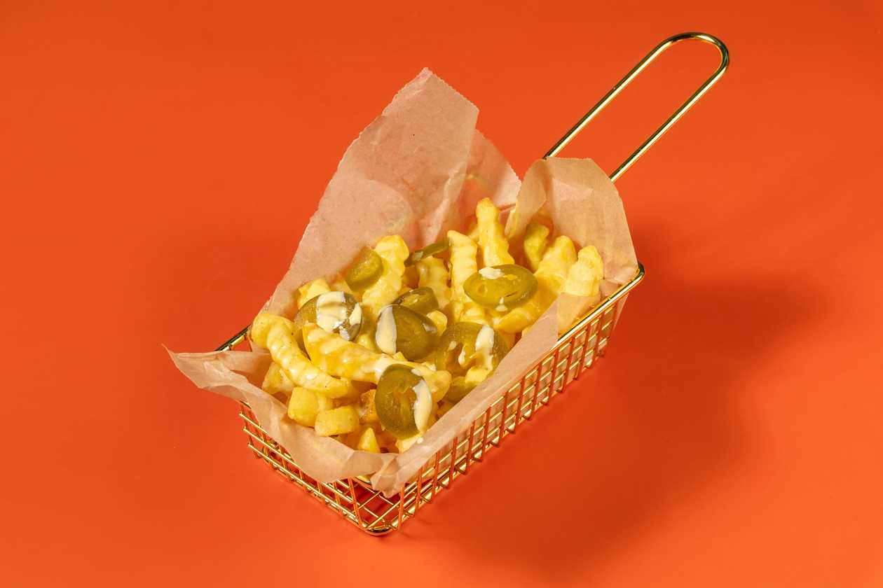 Fries With Cheese Sauce And Jalapeños