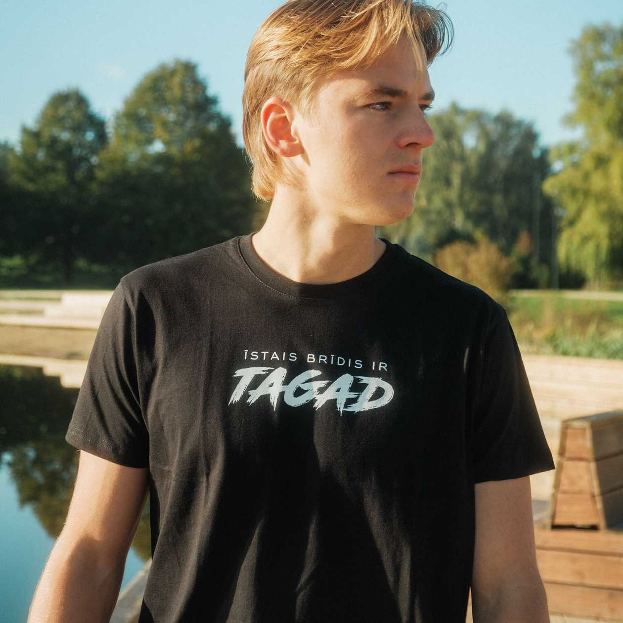 Now. Unisex T-shirt
