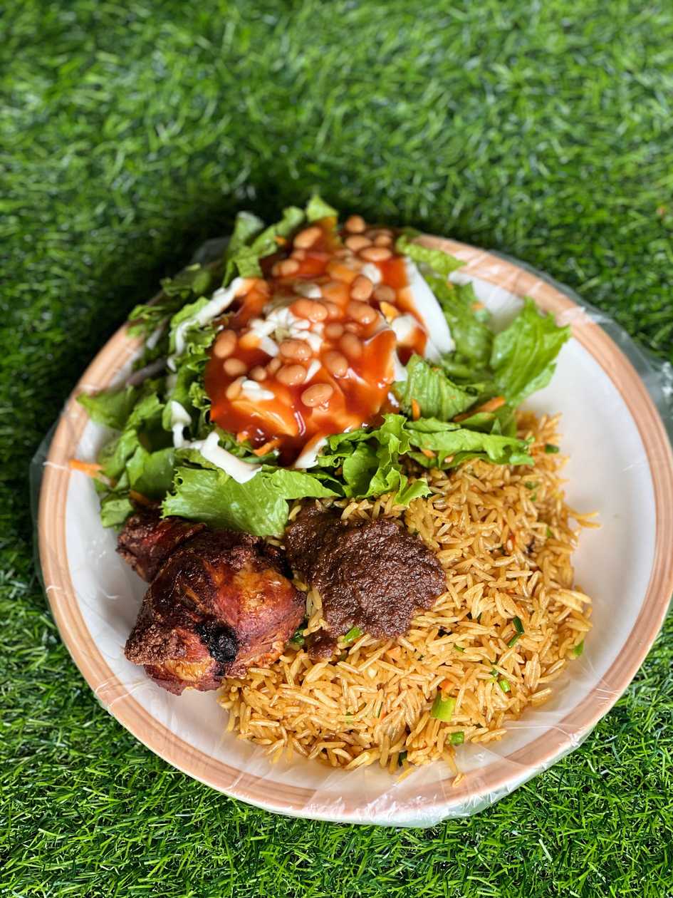 Fried rice with fried chicken and salad, boiled egg and shito