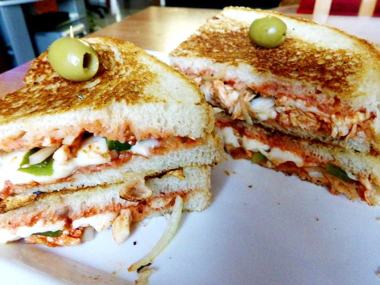 Tikka Chicken and Grilled Onions Sandwich