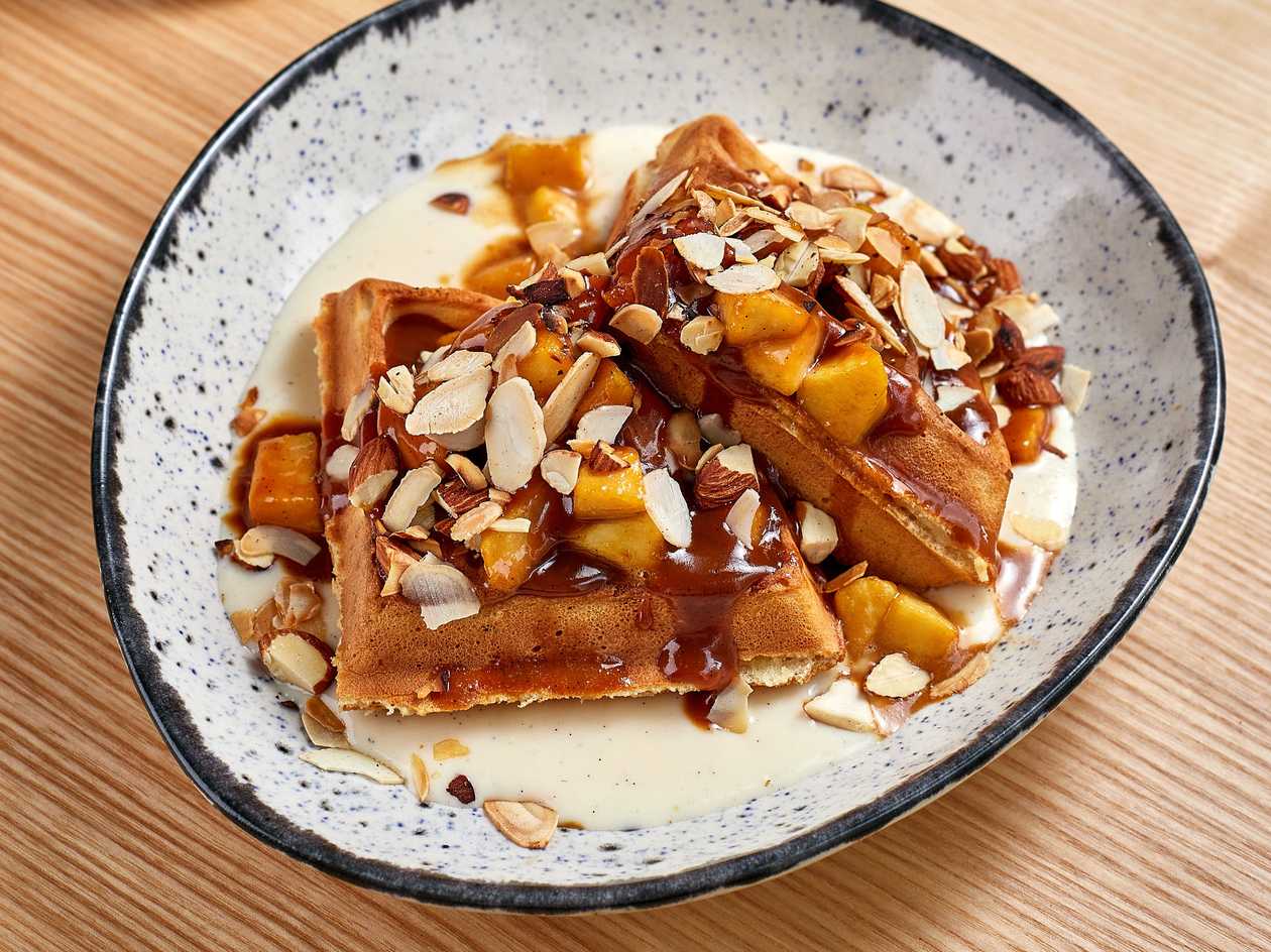 Waffles with caramel, apples and cream