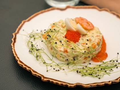 Olivier salad with salmon and avocado