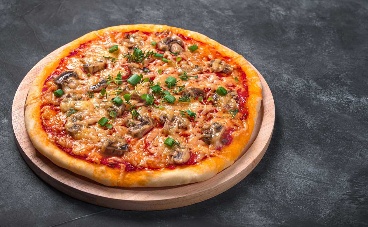 Pizza With Morels, Black Truffles And Gouda Cheese