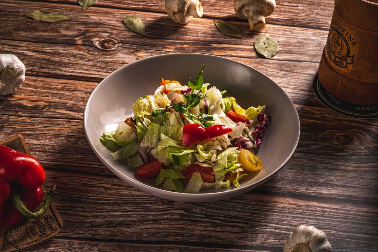 Fresh vegetable salad with olive oil