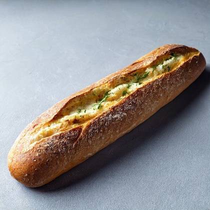 Baked baguette with herb butter