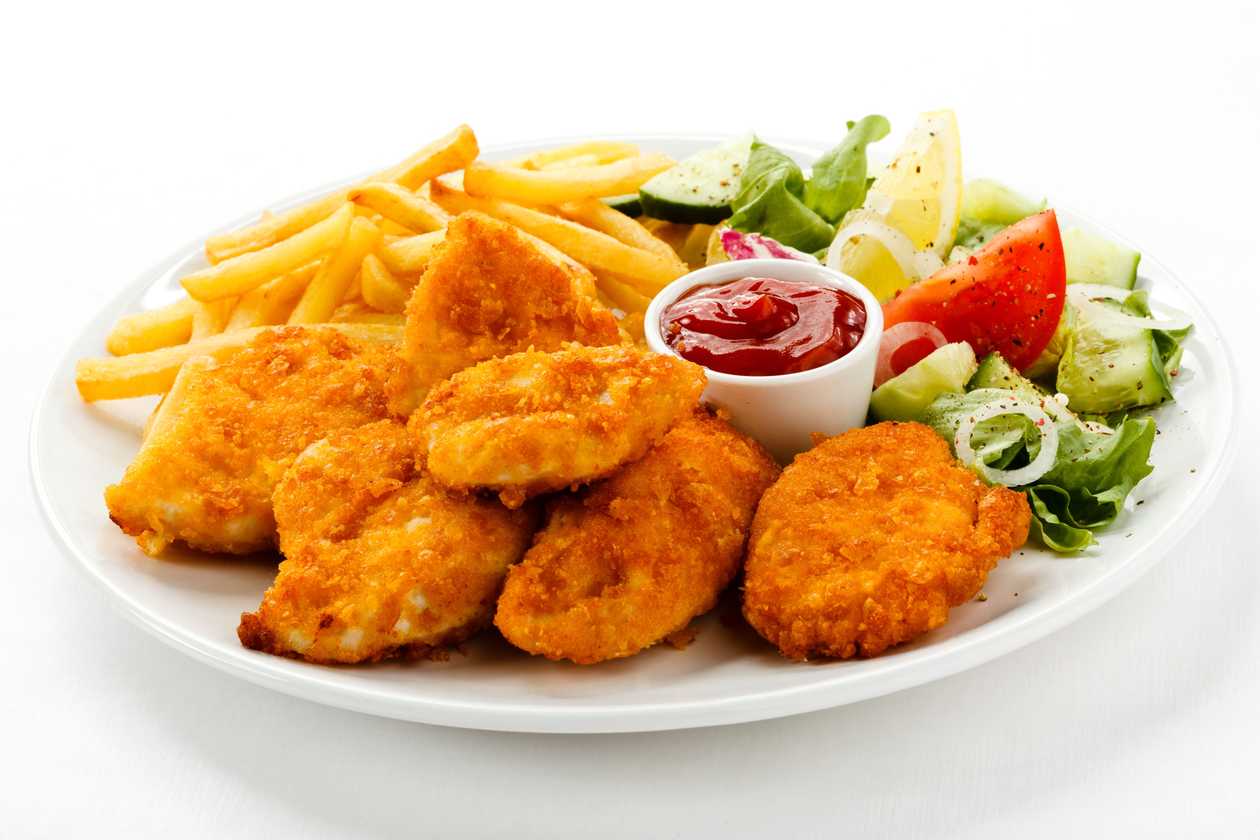 Chicken nuggets in sesame, french fries, ketchup