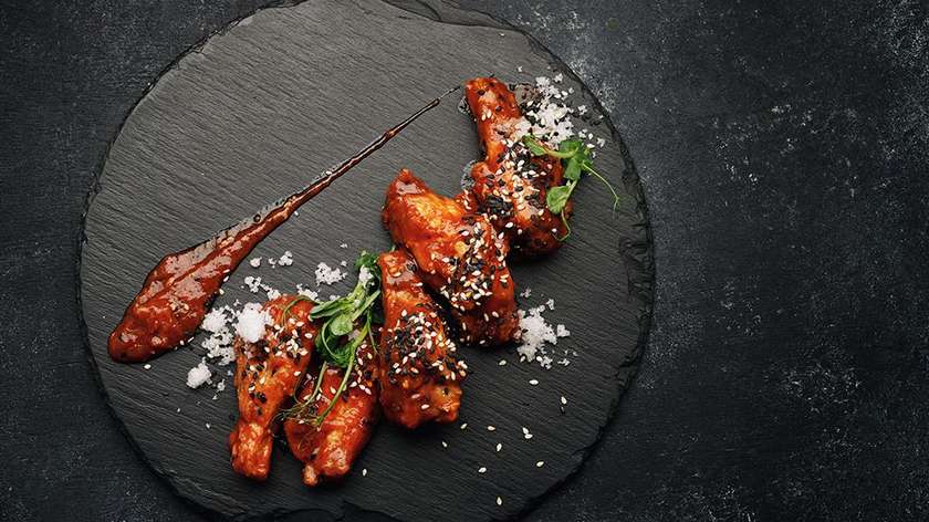 16 pcs. BBQ Chicken wings with Sesame Seeds.