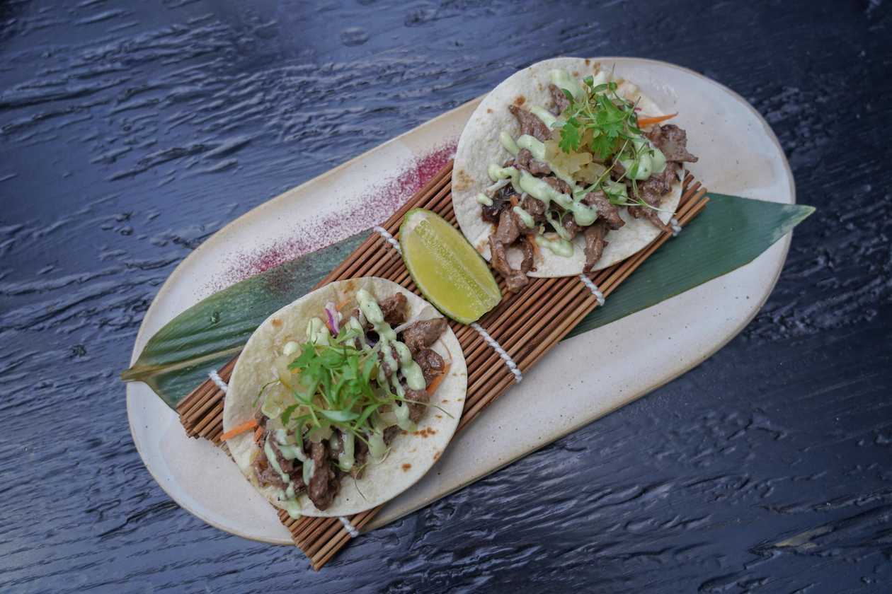 Tacos with beef and caramelized onions