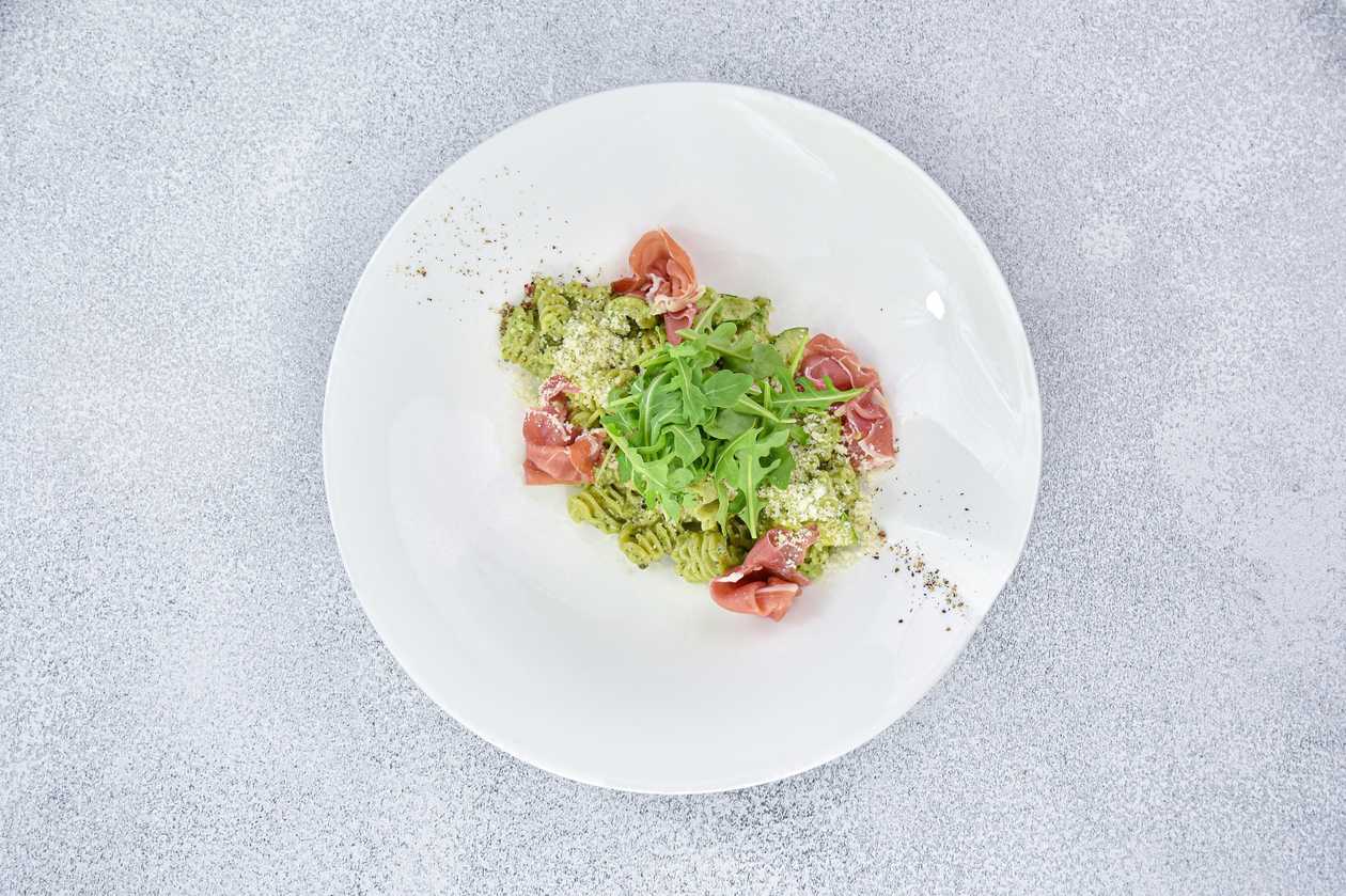 With Serano ham, zucchini and cream-basil pesto sauce