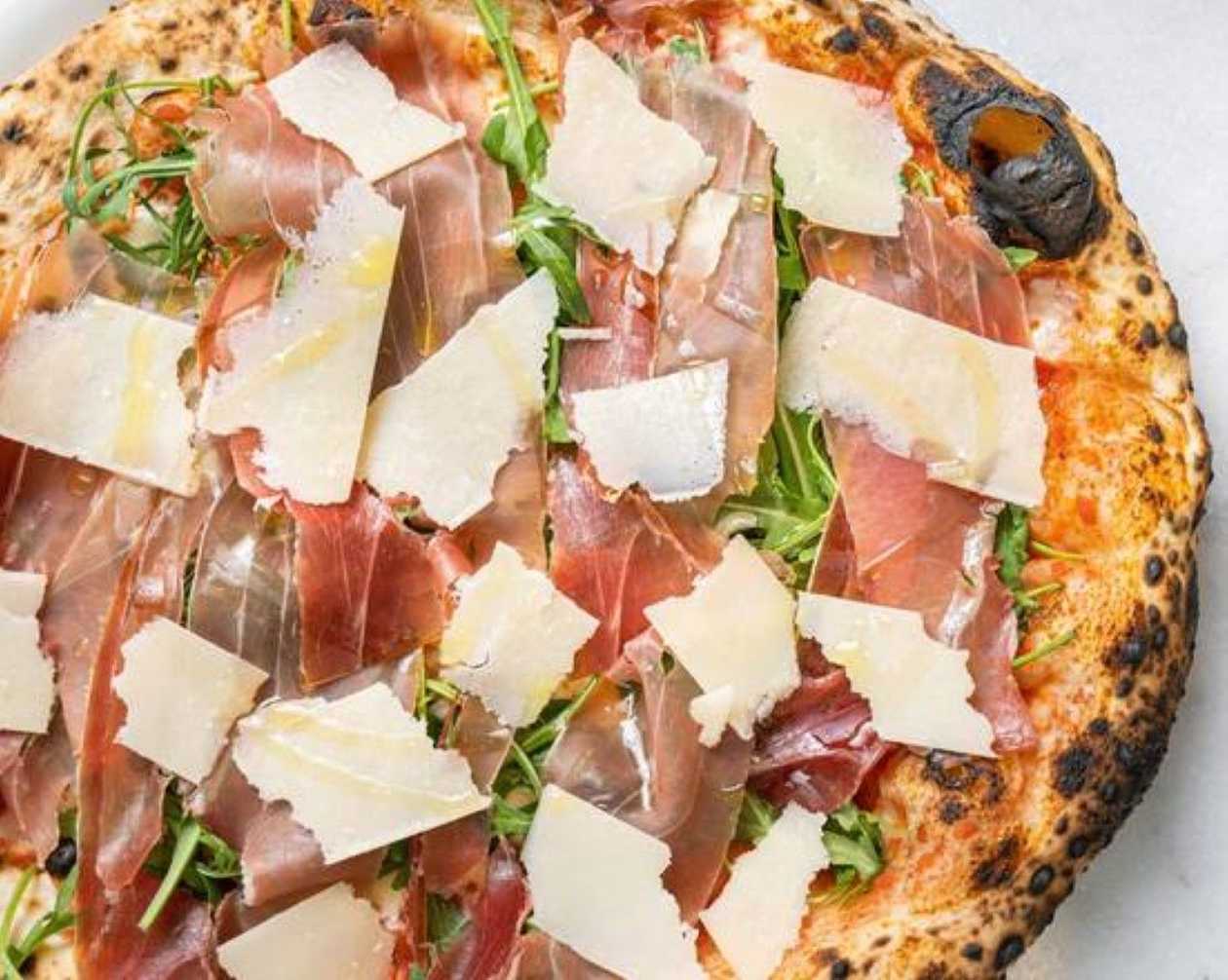 Crudo and Arugula Pizza