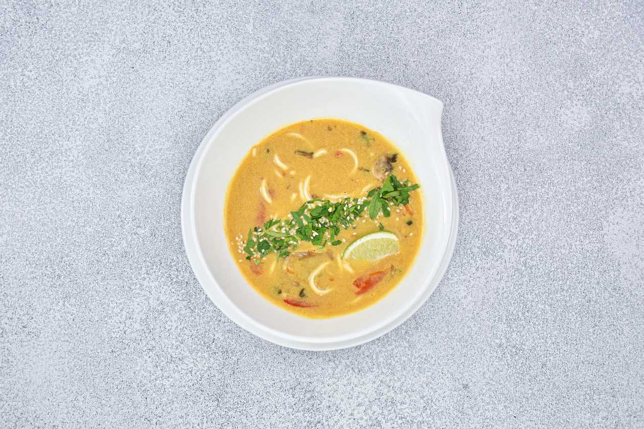 Coconut milk and curry with fried vegetables