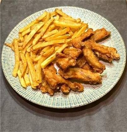 Chicken Ribs in a Fine Crust with French Fries and Garlic Sour Cream