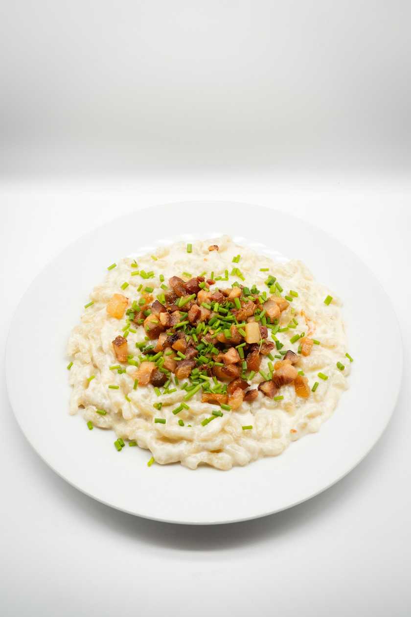 Cheese dumplings with baked smoked bacon and chives