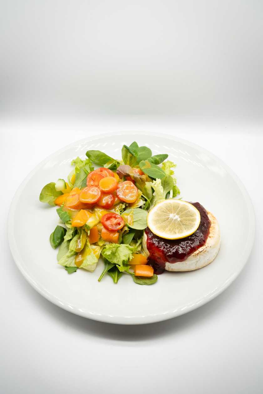 Grilled camembert with mixed salad and honey-mustard dressing and cranberries