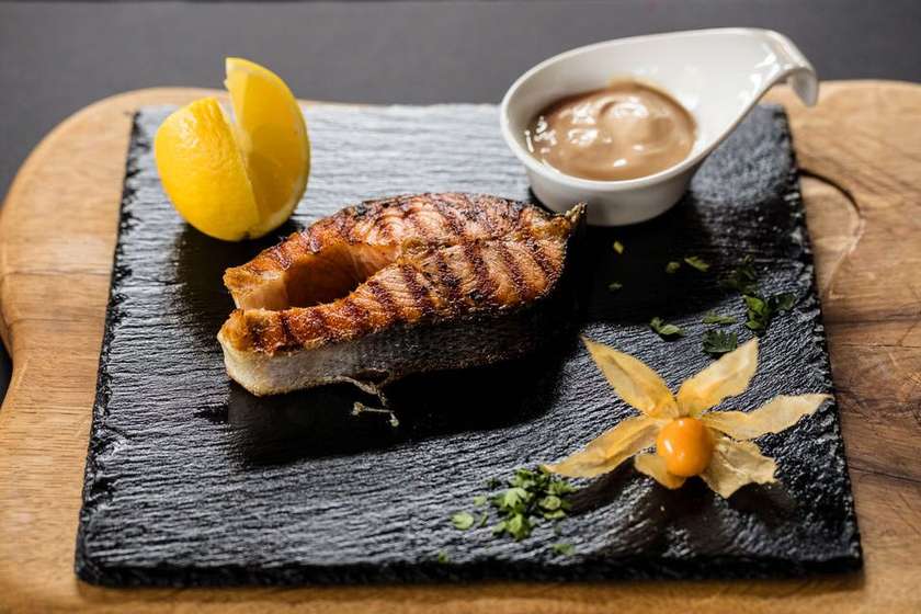 Salmon Horseshoe Steak on a Wooden Charcoal