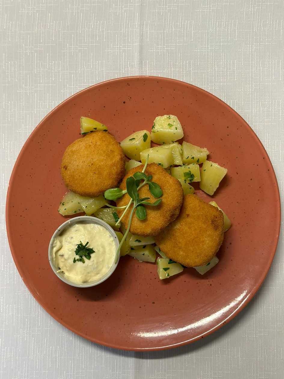 Fried smoked cheese with cooked potatoes and homemade tartar sauce