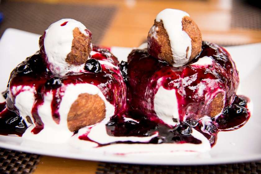 Chesse donuts with sweet sour cream and cranberries or Nutella