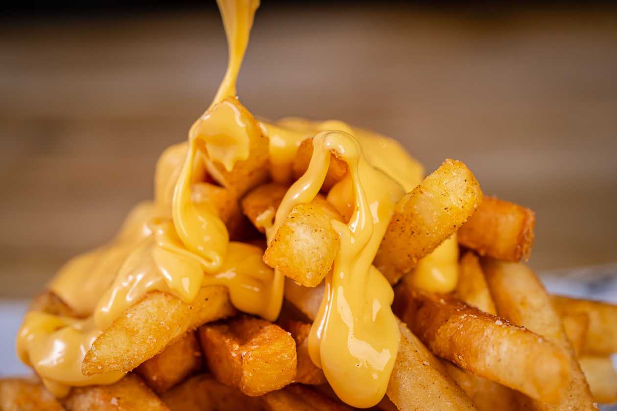 Homemade Fries with Cheddar Sauce and Jalapeño Peppers