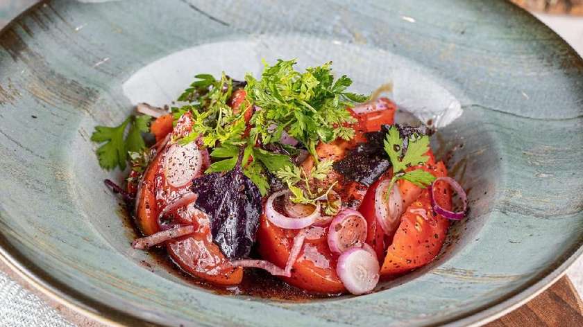 Tomato salad with sour cherry sauce