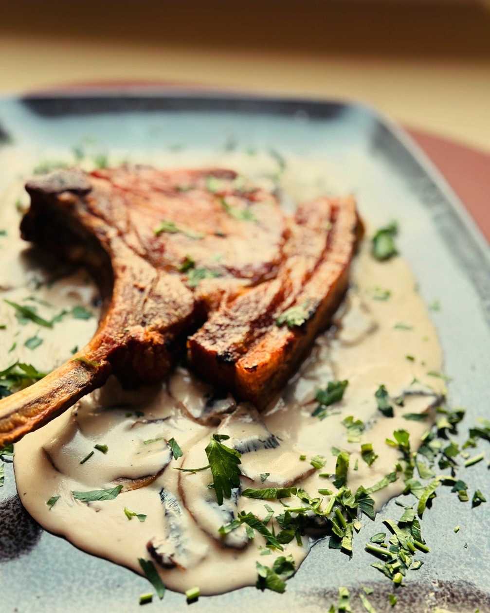 Pork Tomahawk with Mushroom Sauce
