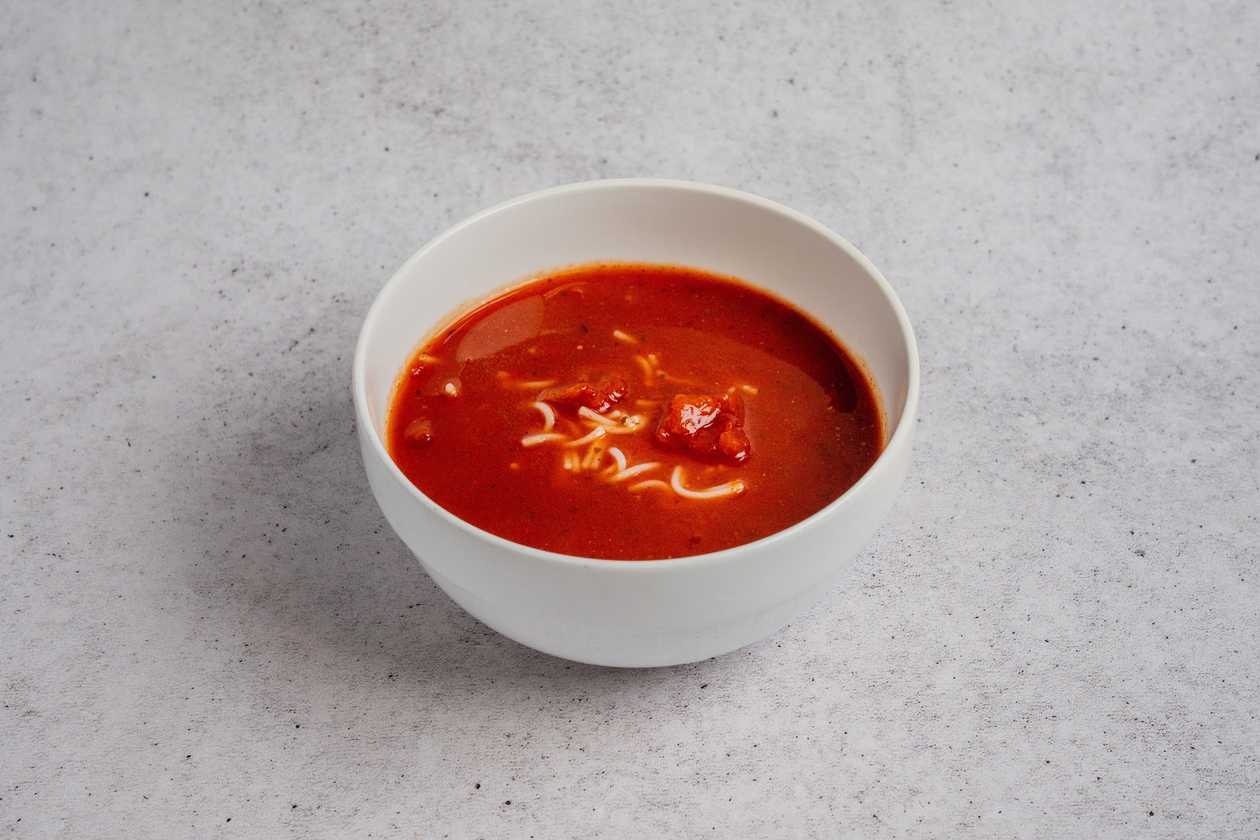 Tomato soup with dumplings and cream